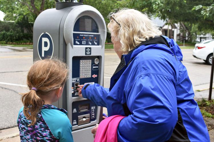 People at Parking Meter
