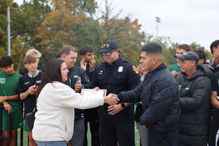 Chada and Arreola accept award on behalf of Kenosha Fire Dept. Engine 6, Med 6
