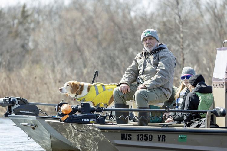 Dogs and searchers hit river