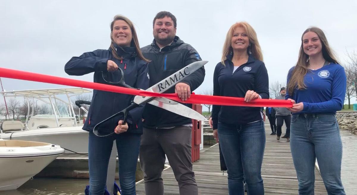 Freedom Boat Club employees cut ribbon
