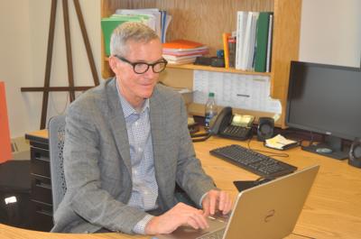 Mayor Tom Hartz works at his desk