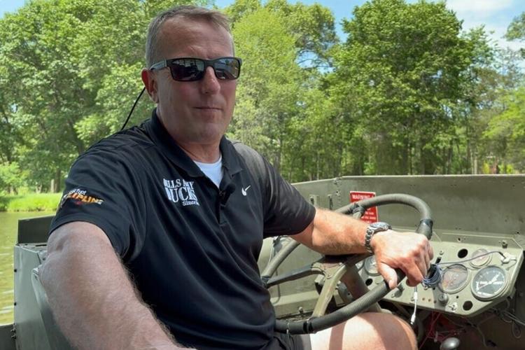 Field travels on amphibious boat