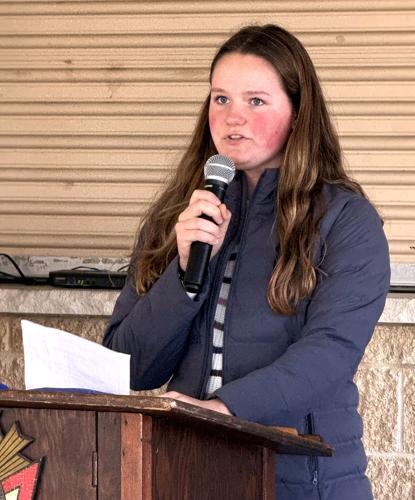 Williams Bay High School freshman Rori Hayes reads "In Flanders Fields" on Veterans Day