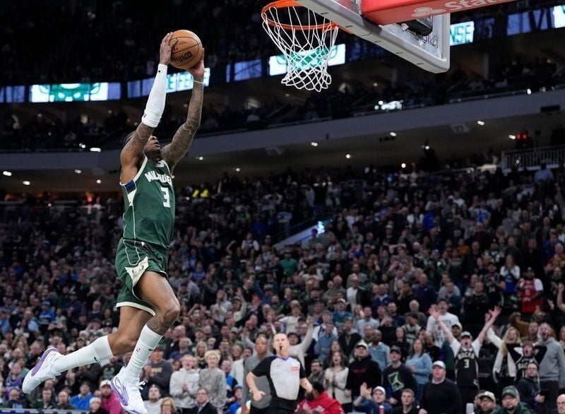 Milwaukee Bucks guard Kevin Porter Jr. dunks against the Minnesota Timberwolves.