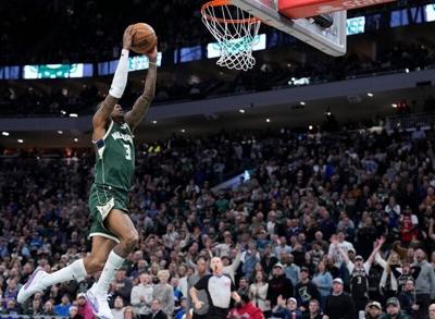 Milwaukee Bucks guard Kevin Porter Jr. dunks against the Minnesota Timberwolves.
