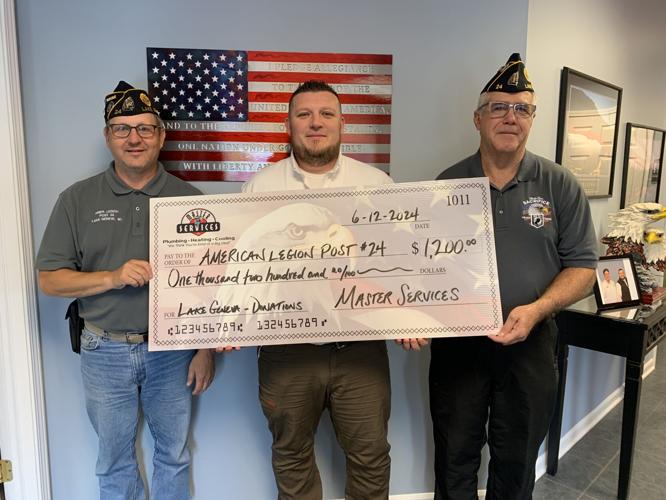 Representatives from Master Services donate a $1,200 check members of Lake Geneva American Legion Post No. 24