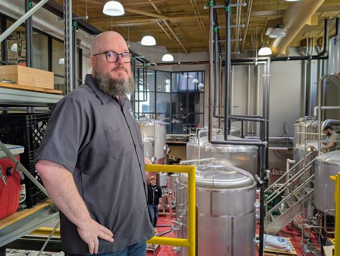 Public Brewing Co. Matt Geary with tanks