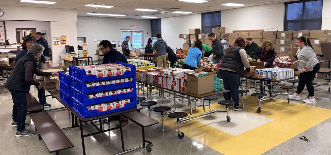 Geneva Lake West Rotary Club Holiday Food Assistance Program packing event at Sharon Community School