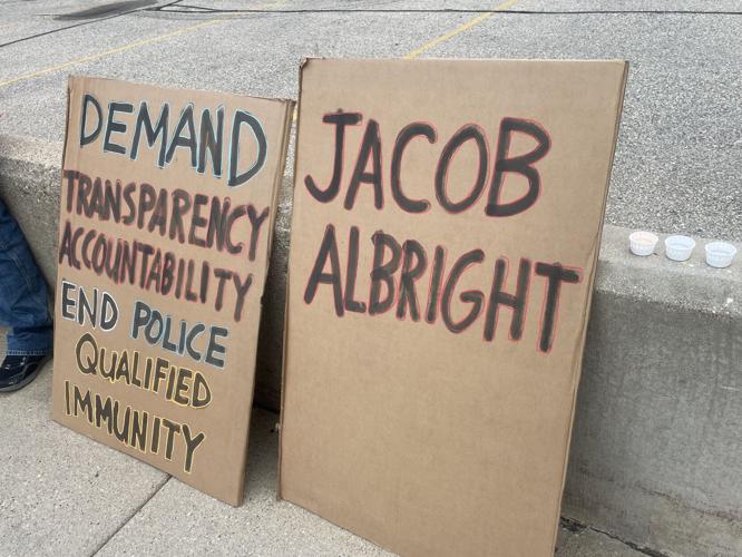 Vigil for man who died from apparent self-inflicted gunshot wound during transport to jail held at Kenosha Courthouse