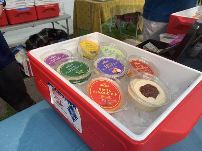 Michael Anagnos displays containers of his Greek almond dip