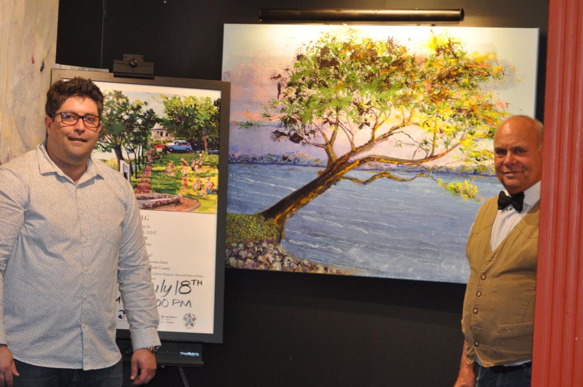 Dariush Nateghi, owner of Gallery LG, and William Edwards stand next to one of Edwards' paintings