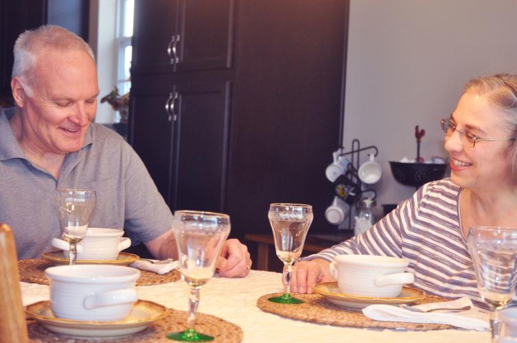Greg and Nina Schipp in the dining area of their new Symphony Bay home