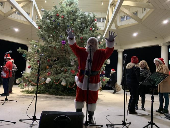 Santa arrives and greets visitors