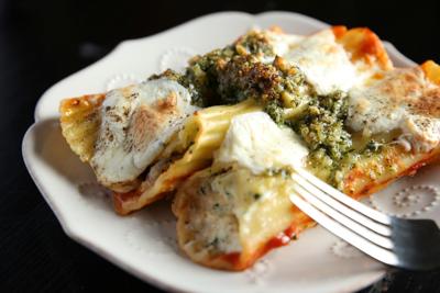 Saucy, cheesy stuffed manicotti with coppa and rustic pesto