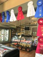 Wisconsin State Fair meat products contest ribbons on display at Wilson Farm Meats, Elkhorn