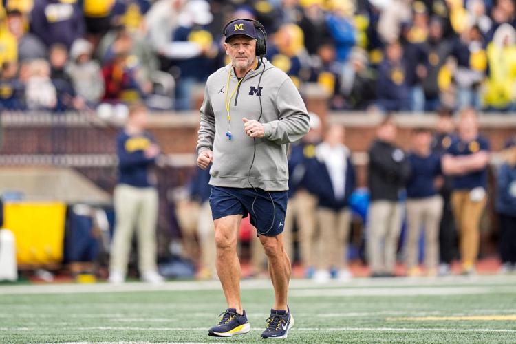 Michigan head coach Kyle Whittingham runs across the field during the spring game at Michigan Stadium in Ann Arbor on Saturday, April 18, 2026.