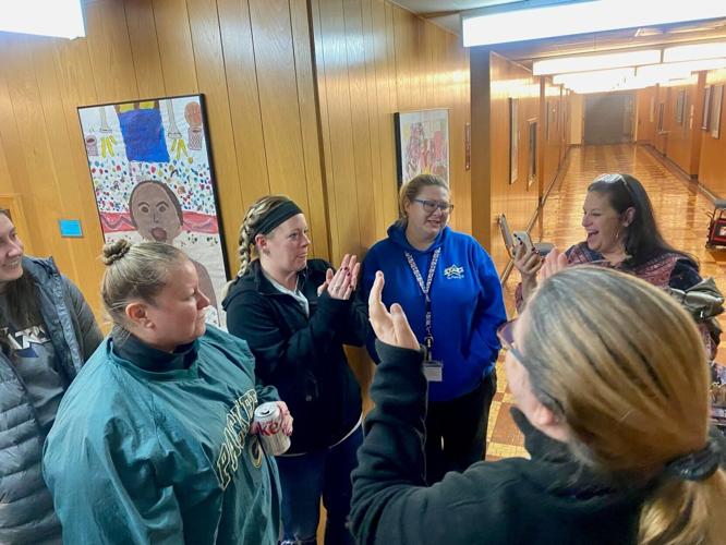 Sennett staff celebrates principal's reinstatement