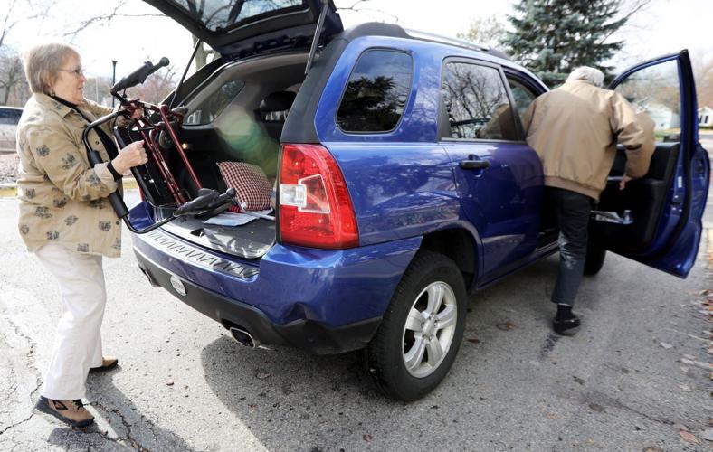 Mary loading Don's walker