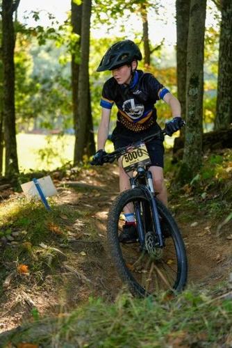 Josiah Sanders shows off his cycling skills during a race last year