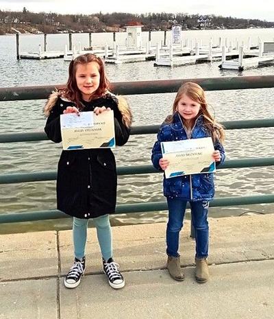 Geneva Lakes Environmental Agency Ice-On Contest award winners Avery Stefaniak and Avery Brunning