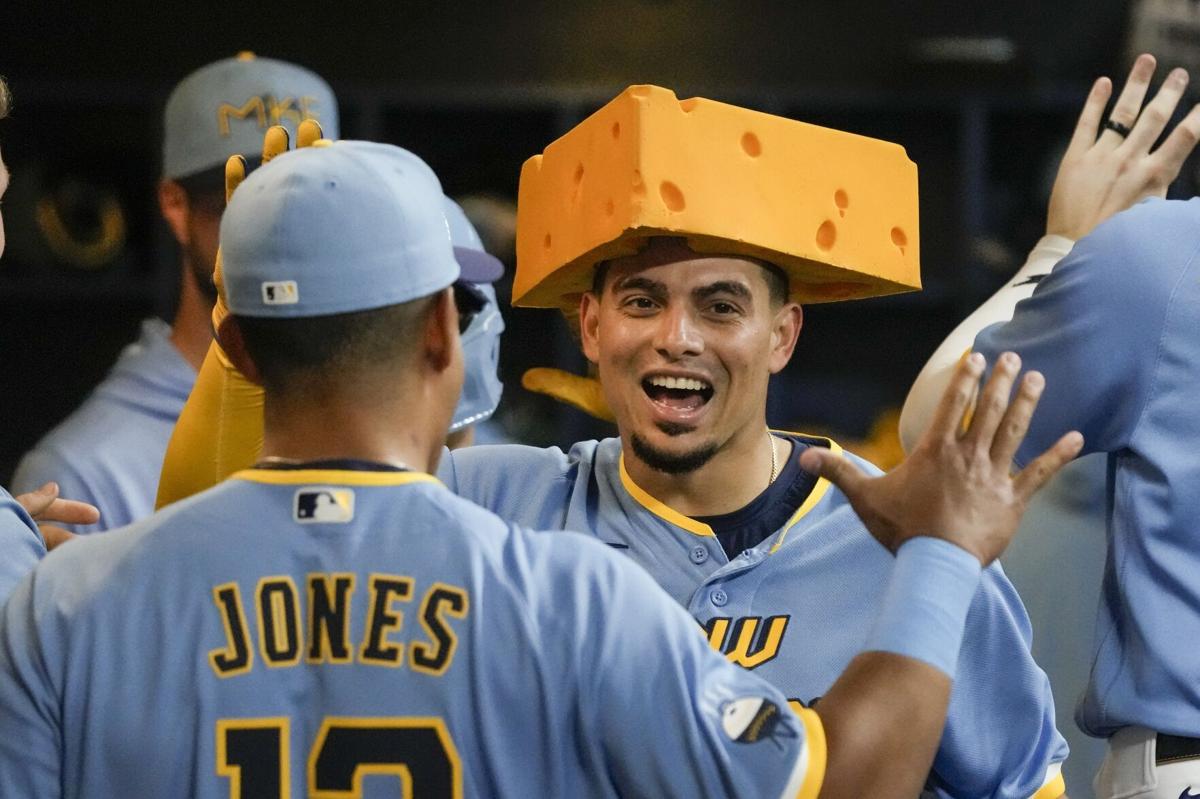 Rowdy Tellez in cheesehead after homer, AP photo