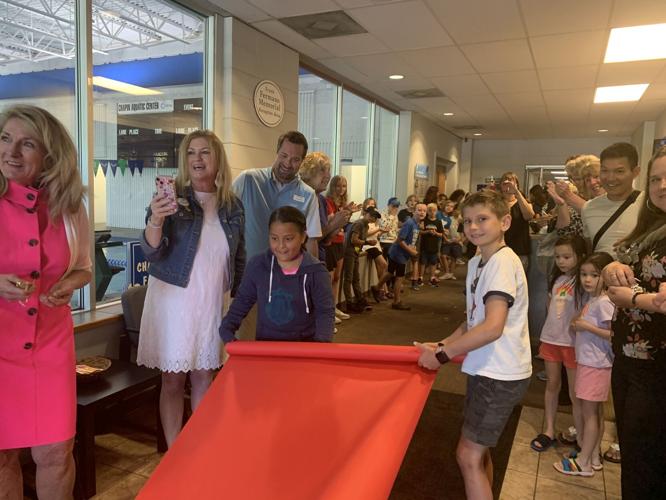 Geneva Lakes Family YMCA staff and members roll out the "red carpet" for Mr. Lake Geneva Skip Harless