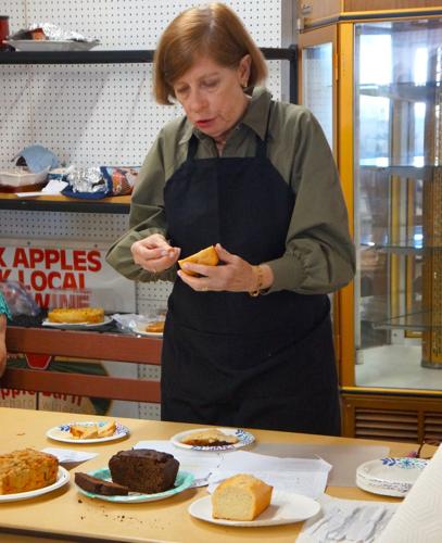 Carol Steilein judges beer breads in the Aug. 30 open foods competition