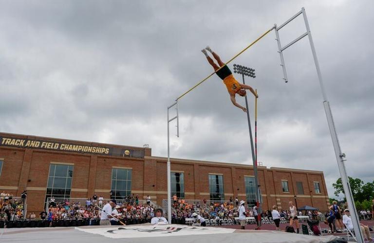 Green Bay Preble's Maximus Davis clears the bar in the pole vault during the first day of the WIAA state track and field meet June 5.
