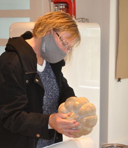 Jill Hoffmann of Waterford examines a decorative pumpkin item during a recent visit