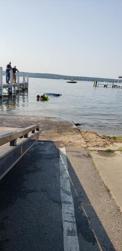 Car rolls into the lake