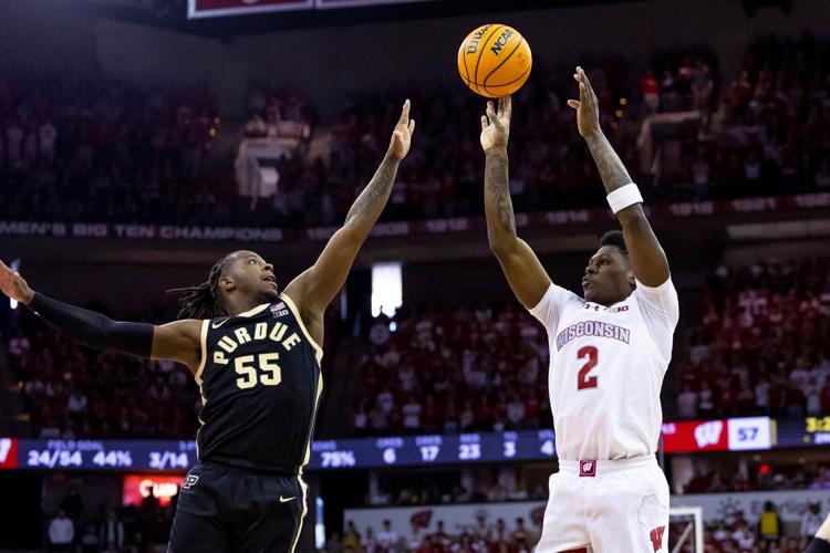 AJ Storr shoots over Lance Jones