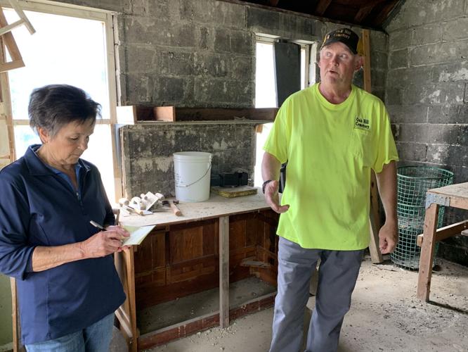 Alderwoman Linda Frame and Sexton Clint Melancon discuss some repair work that could be completed to a former sexton office