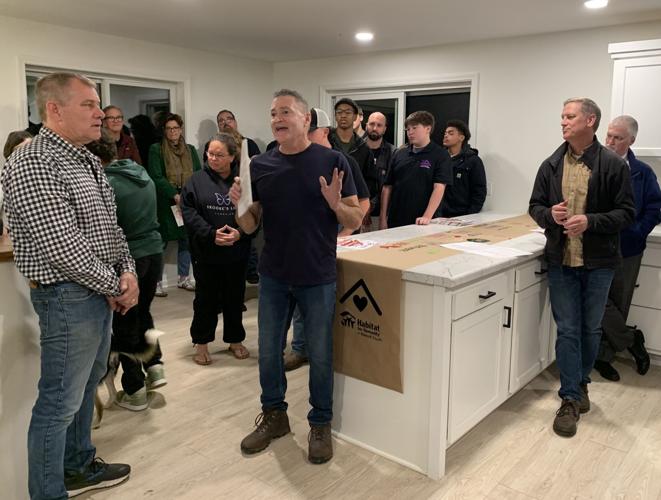 John Dawson, executive director for Habitat for Humanity Walworth County, thanks volunteers for helping to construct the organization's newest home
