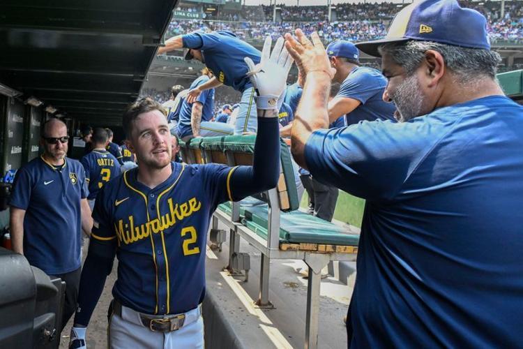 Milwaukee Brewers second baseman Brice Turang (2) celebrates in the dugout after hitting a home run against the Chicago Cubs during the third inning Wrigley Field on Aug. 18, 2025.