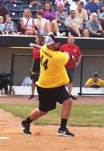Retired Milwaukee Bucks center Paul Mokeski connects for the Gold Team at the July 15 Legends Celebrity Softball Game at Rockford Rivets Stadium