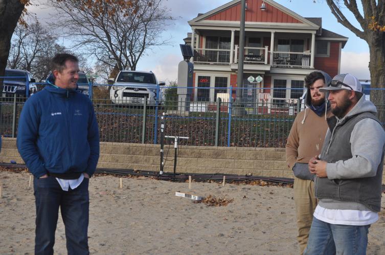 Ryan Davis, Ice Castle CEO, Joe Wieler, Ice Castle employee, and Jesse Stone, site manager, discuss upcoming work that needs to be done to the ice structure