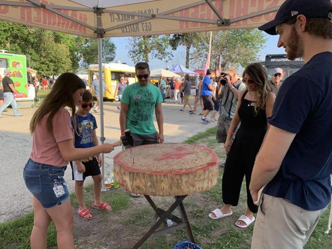 The Reid family of Powers Lake participate in a nail-hammering game