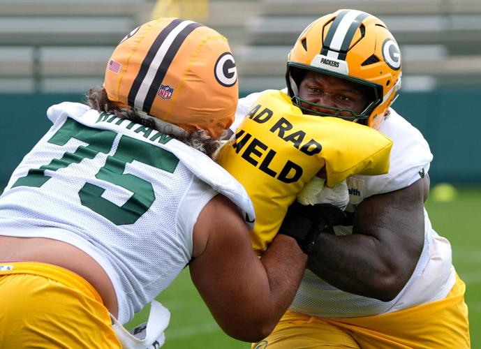 Green Bay Packers Sean Rhyan (75) and Dillon Wade (68) participate in mandatory minicamp Thursday, June 11, 2026, at the Don