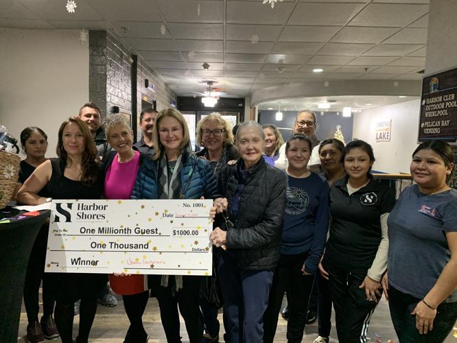 Diana Thompson received a check for $1,000 for being Harbor Shores on Lake Geneva's one millionth guest