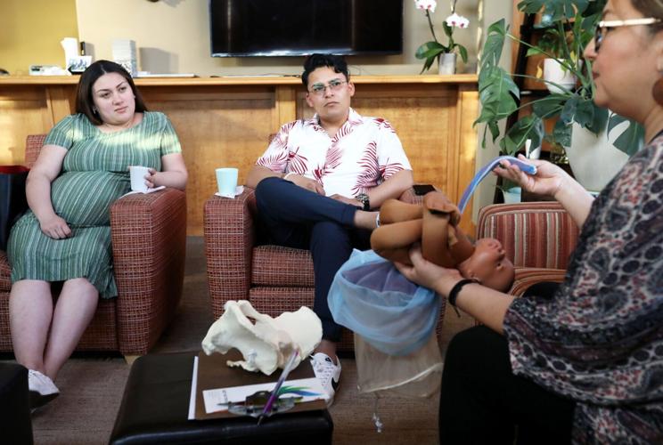Yenny and Bryan listening to Maricela