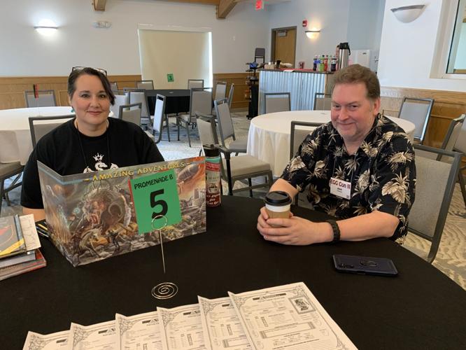 Heather Ashcraft and Jon Johnson wait to greet other roleplay gaming enthusiasts during EGG Con II