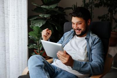 Young Man looking at digital tablet