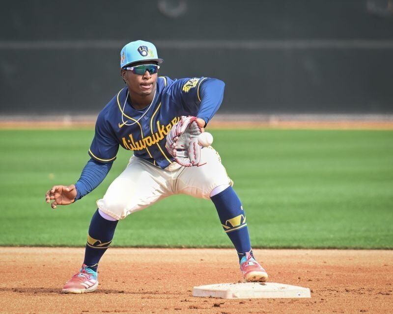 Milwaukee Brewers infield prospect Luis Pena takes a throw in a double-play drill during spring training workouts Sunday, February 15, 2026, at American Family Fields of Phoenix in Phoenix, Arizona.