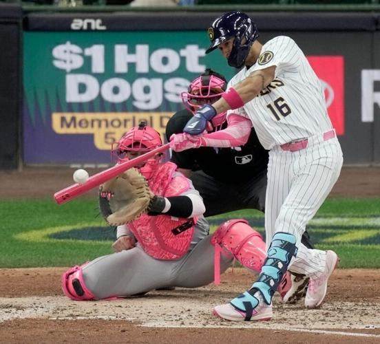 Milwaukee Brewers left fielder Blake Perkins hits a two-run single against the New York Yankees.