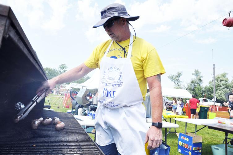Mike Brttain grilling brats at 2019 Lake Fest