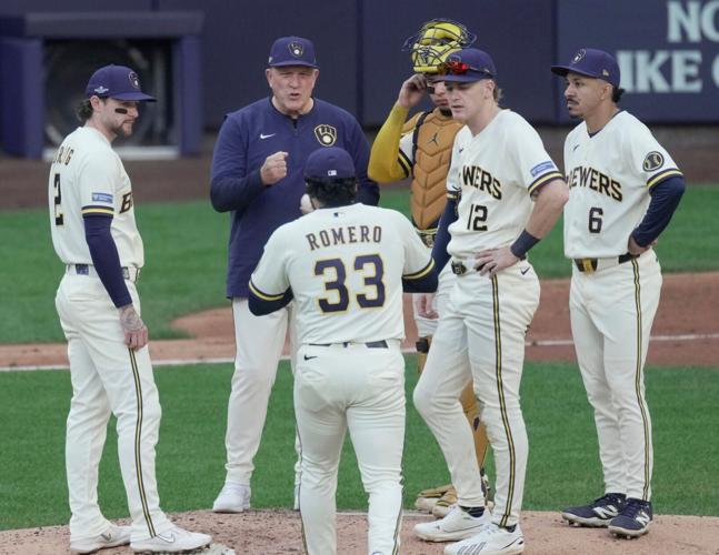 Milwaukee Brewers manager Pat Murphy waits for pitcher Jojo Romero (33) to enter the game during the sixth inning of their