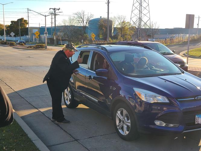 Tom Marquis giving out candy