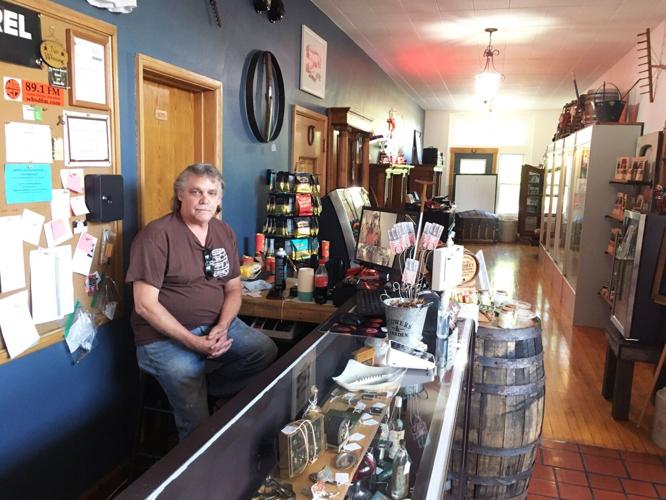 Dan Wilburth inside new location for his Rustic Barrel antique shop in Town of Burlington