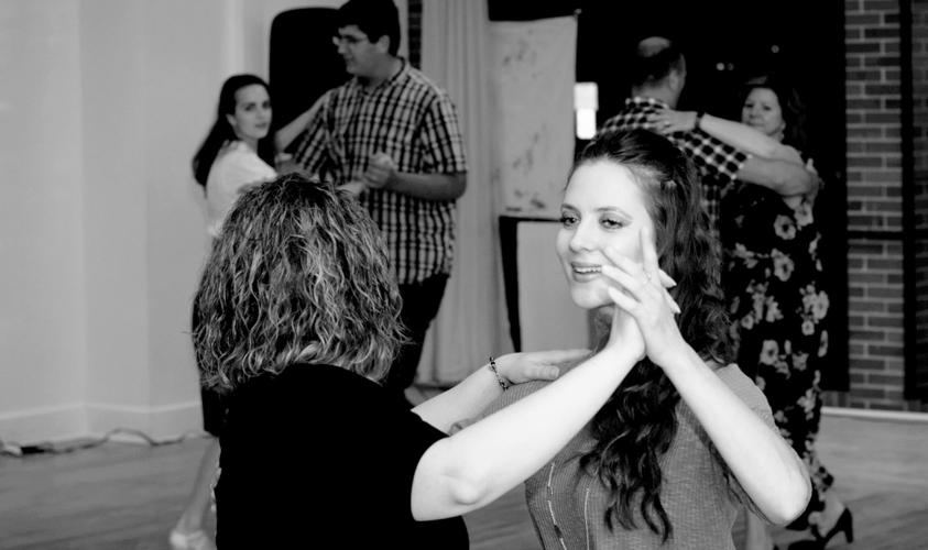 Swanson dancing with a student