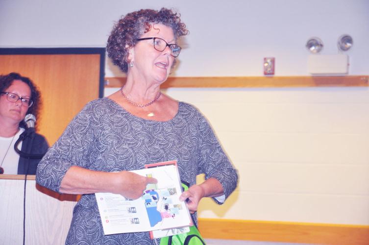 Sarah McConnell, avian committee member, discusses the bird-watching kits